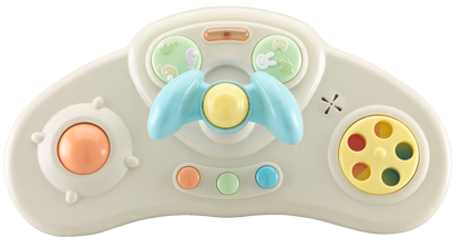 Toy steering wheel with colorful buttons on a white background