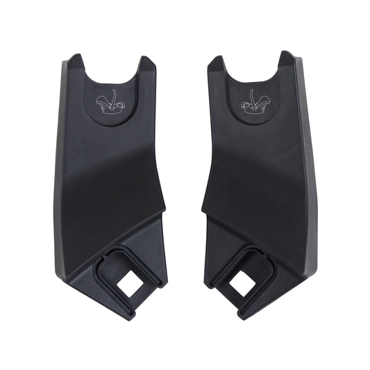 Two black plastic car seat anchors on a white background