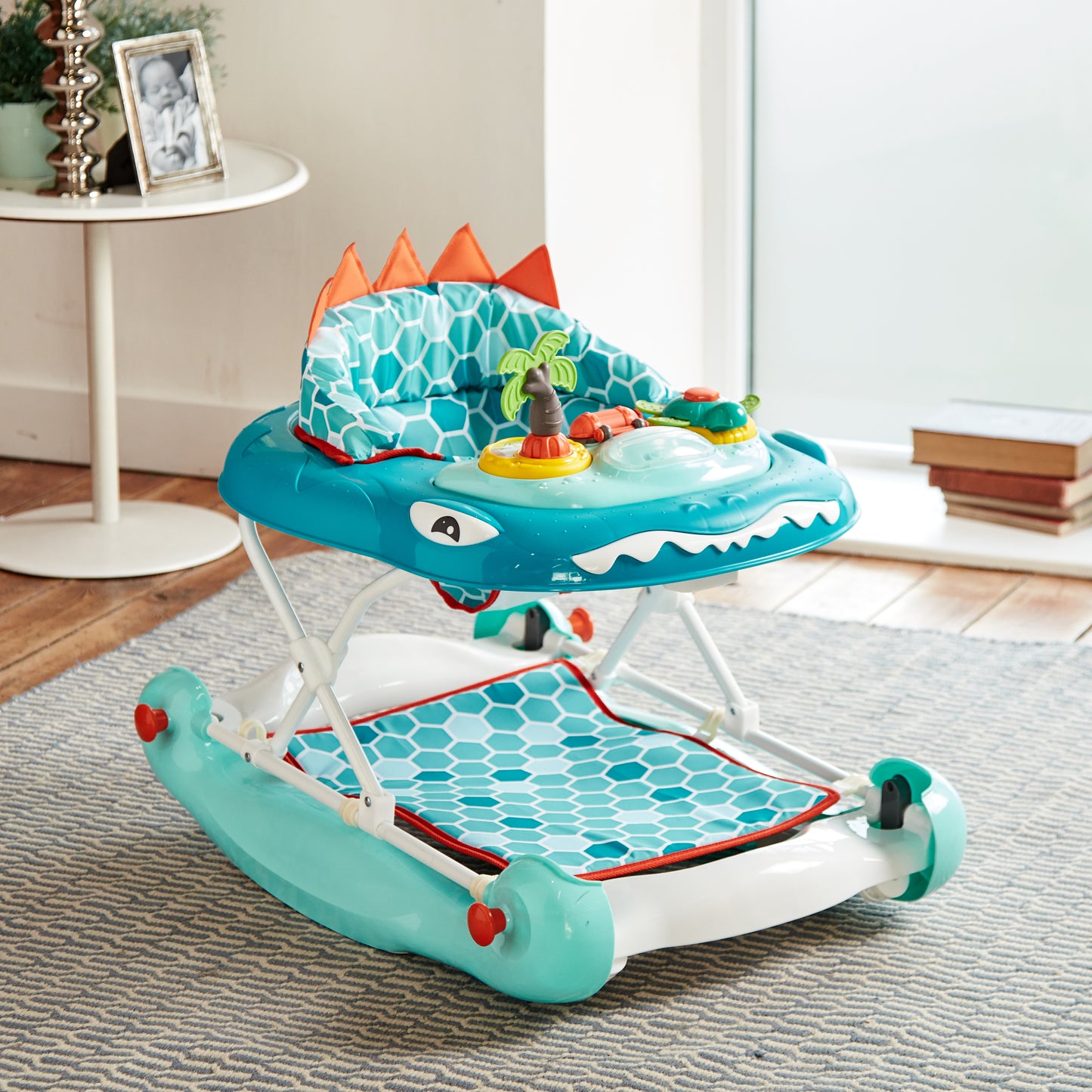 Children's dinosaur-themed walker in a room setting