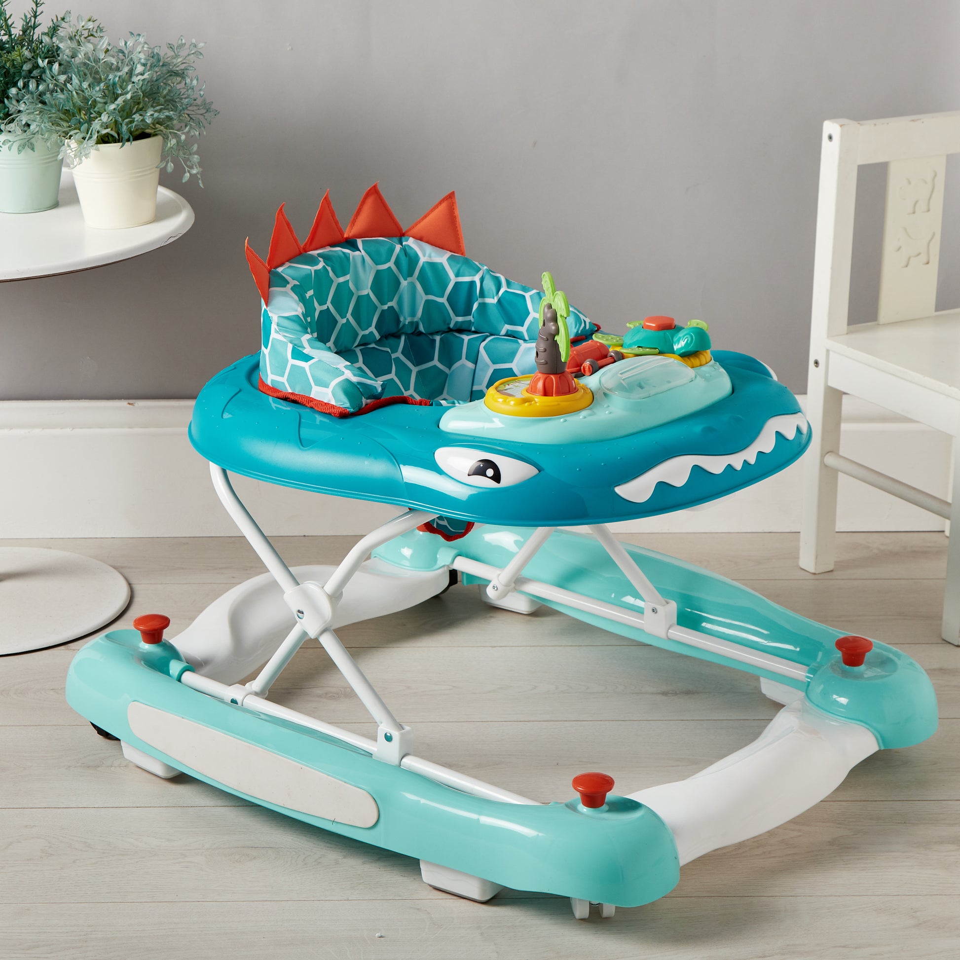 Children's walker with shark design in a room setting