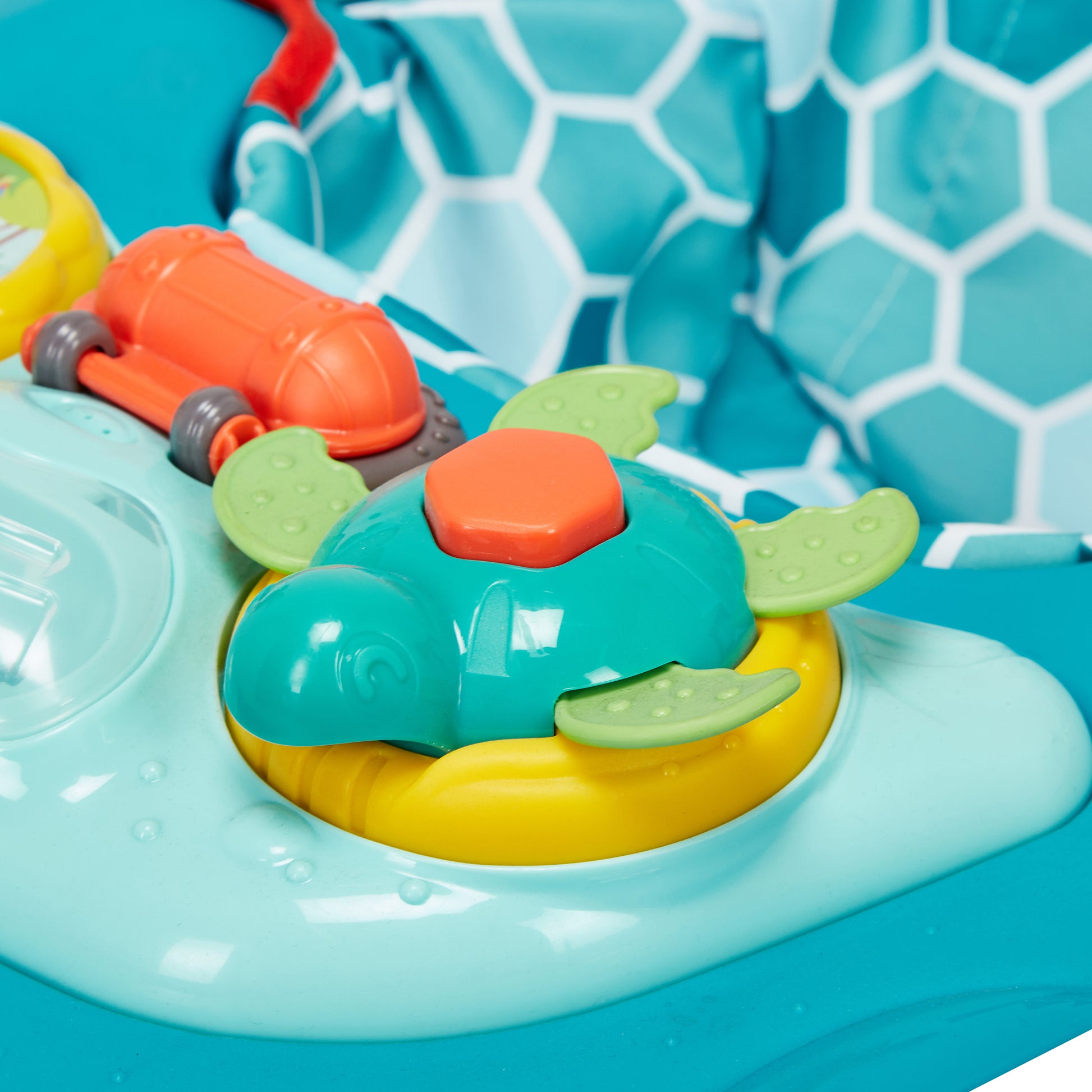 Colorful toy with orange, green, and yellow elements on a blue background