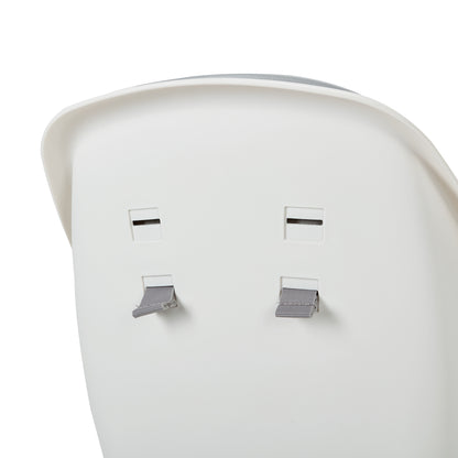 Close-up of Lars highchair seat back with harness slots