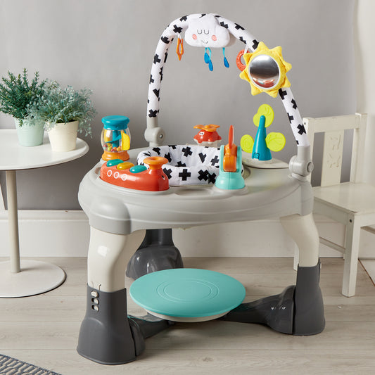 Children's activity center with toys and a stool on a wooden floor.