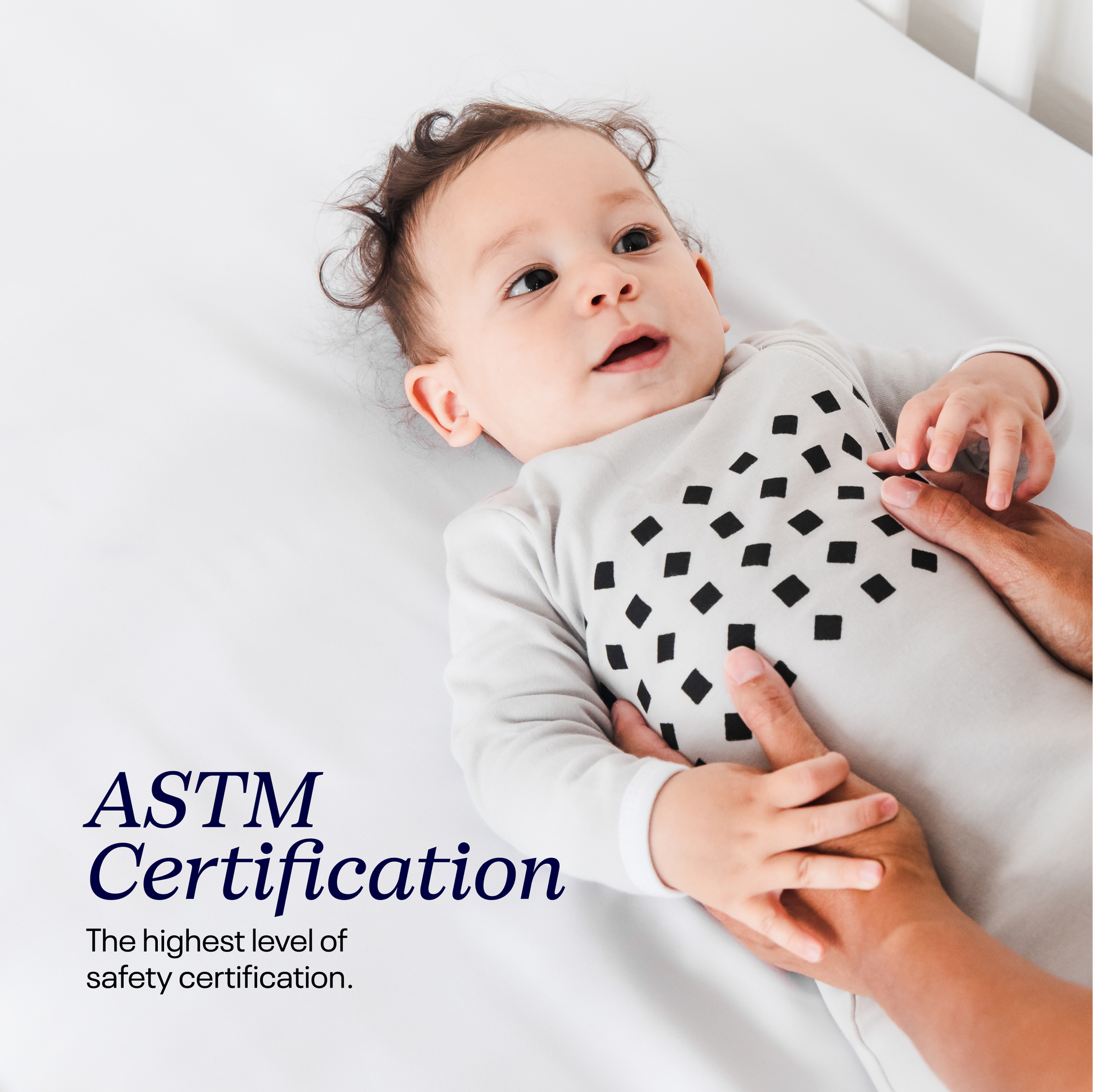 Baby wearing a patterned outfit with ASTM Certification text overlay