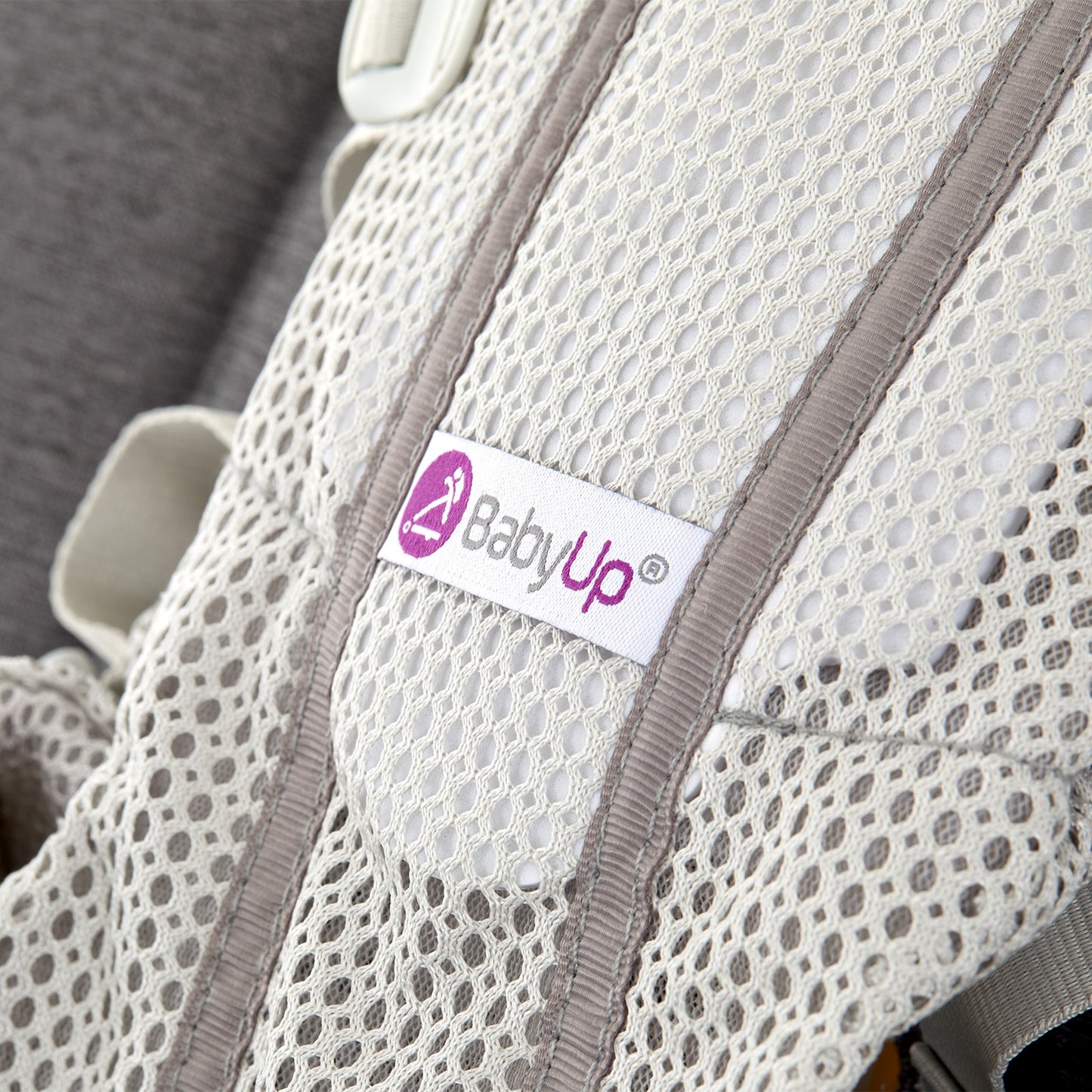 Close-up of BabyUp® seat fabric and logo label