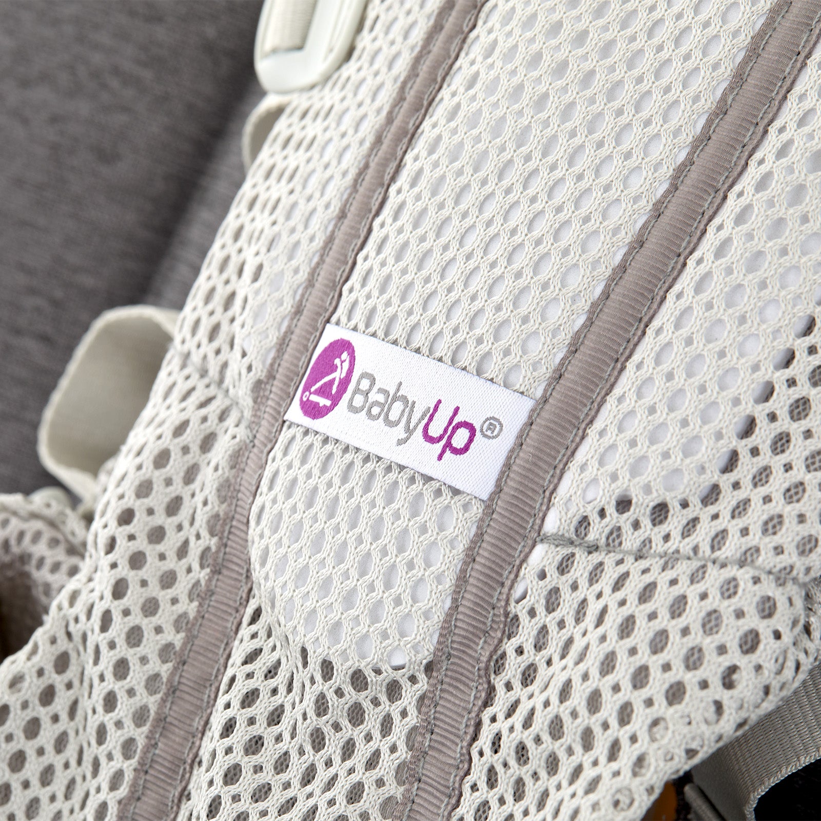 Close-up of BabyUp® seat fabric and logo label