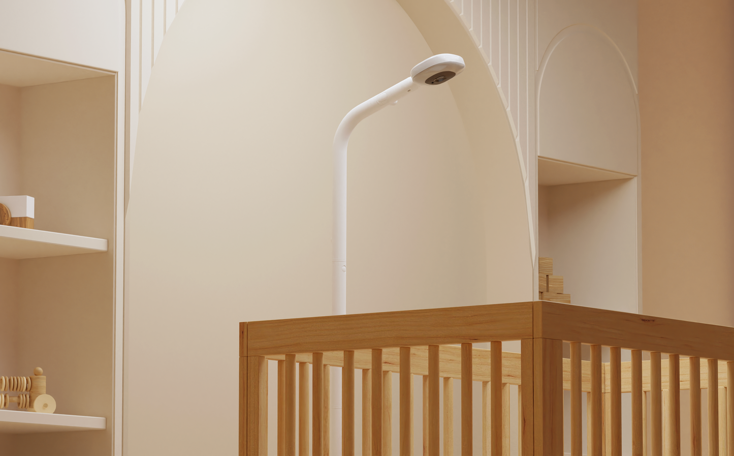 Nanit Pro camera on floor stand positioned next to cot (bird’s-eye view)